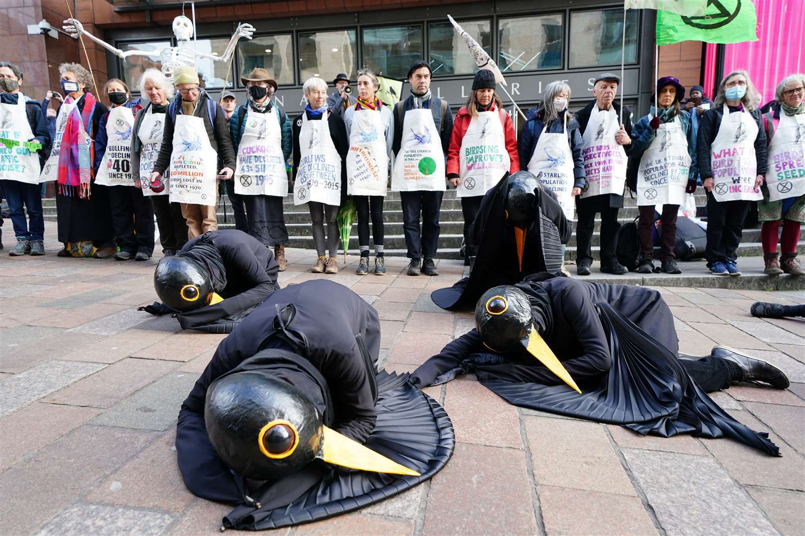 Also on Buchanan Street on Wednesday morning, members of climate activist group Extinction Rebellion staged a stunt (Jane Barlow/PA)