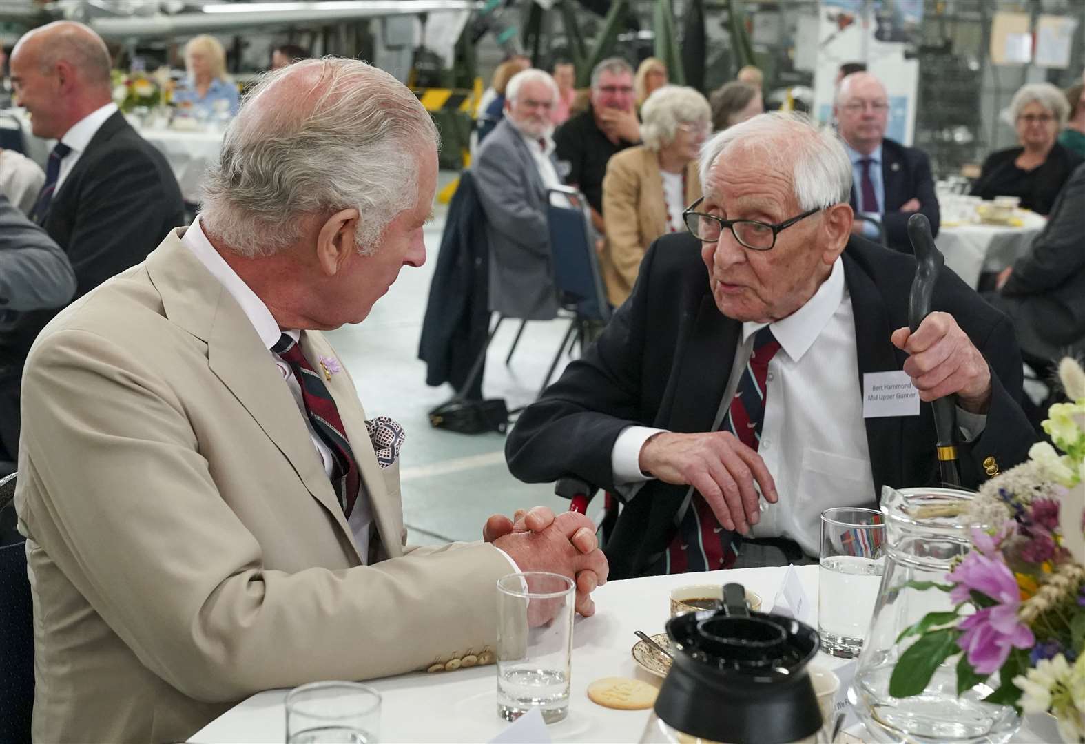 The King Charles speaks to veteran Burt Hammond during a visit to Coningsby, Lincolnshire (Arthur Edwards/The Sun/PA)