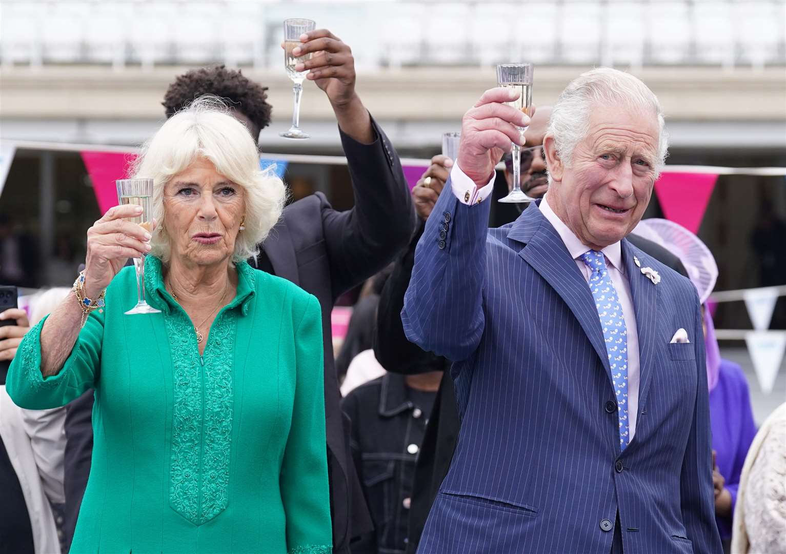 Charles and Camilla make a toast (Stefan Rousseau/PA)