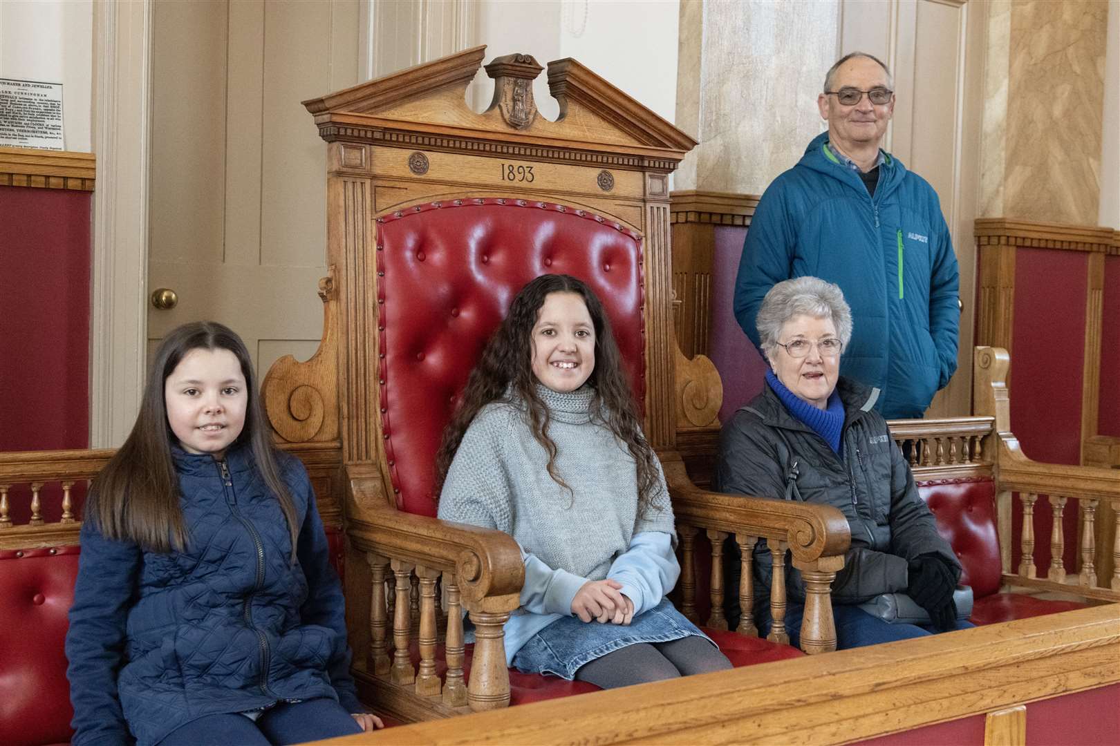 Laura and Lucy Hislop, and volunteers Susie Haworth and Peter Haworth in the Tolbooth courtroom.
