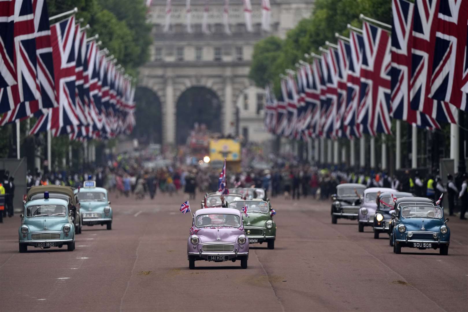 Morris Minors on The Mall during the Jubilee Pageant. Frank Augstein/PA