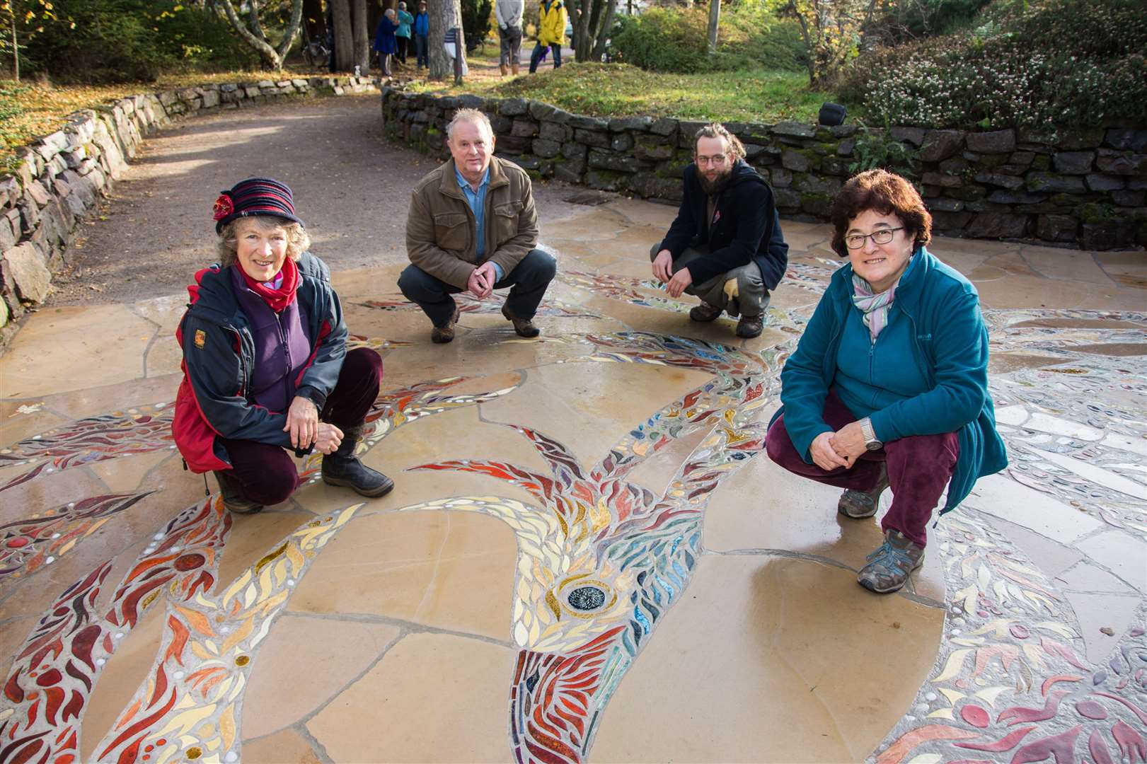 (From left) designer Lesley Downie, stonemasons Stuart Voder and Sebastian Freudenthal, and assistant art director Marialaura Romagnoli at the Findhorn Foundation and Community's mosaic outside the Universal Hall. Picture: Becky Saunderson.