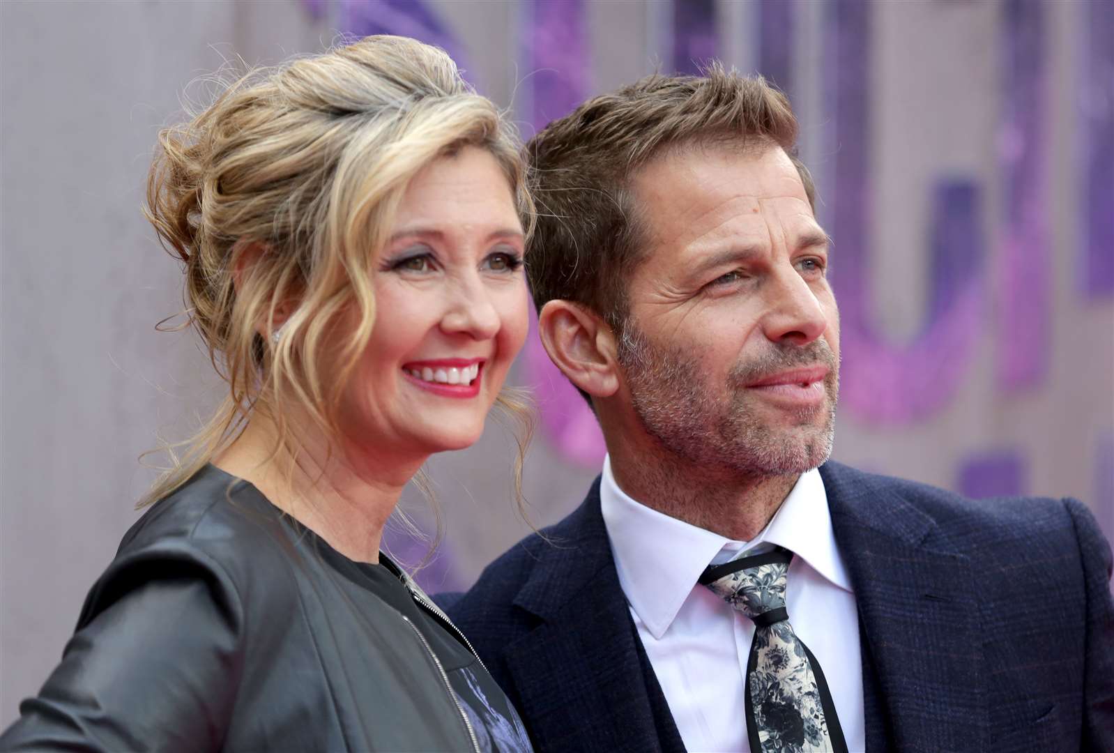 Hargobind Tahilramani is accused of pretending to be Deborah Snyder, left, pictured with her director husband Zack (Daniel Leal-Olivas/PA Wire)
