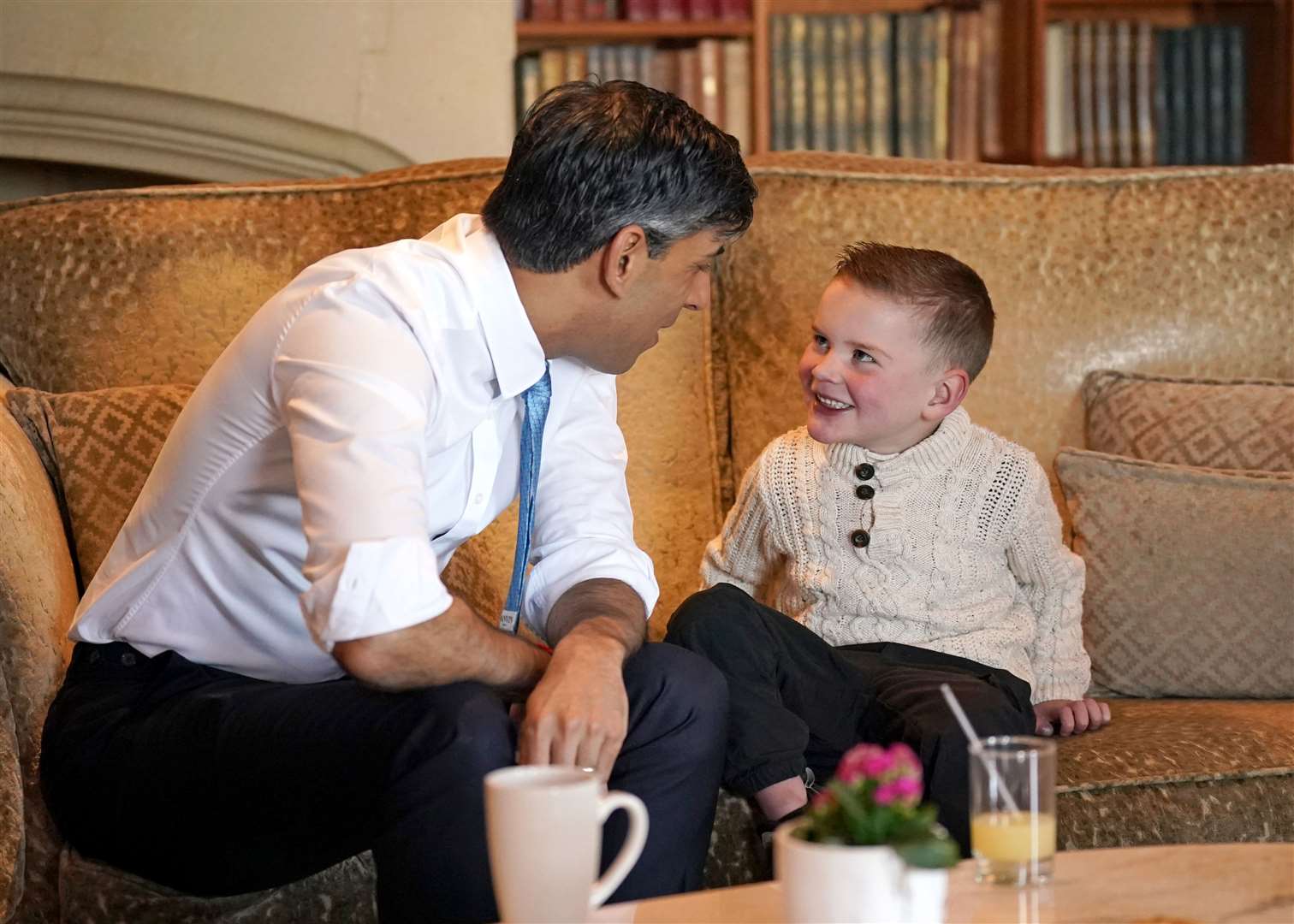 Prime Minister Rishi Sunak chats to six-year-old Daithi (Niall Carson/PA)