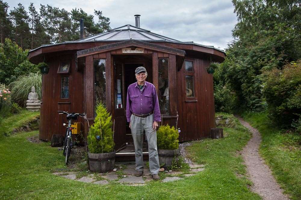 PET chairman, Roger Doudna outside his unique whisky barrel house in The Park at Findhorn.