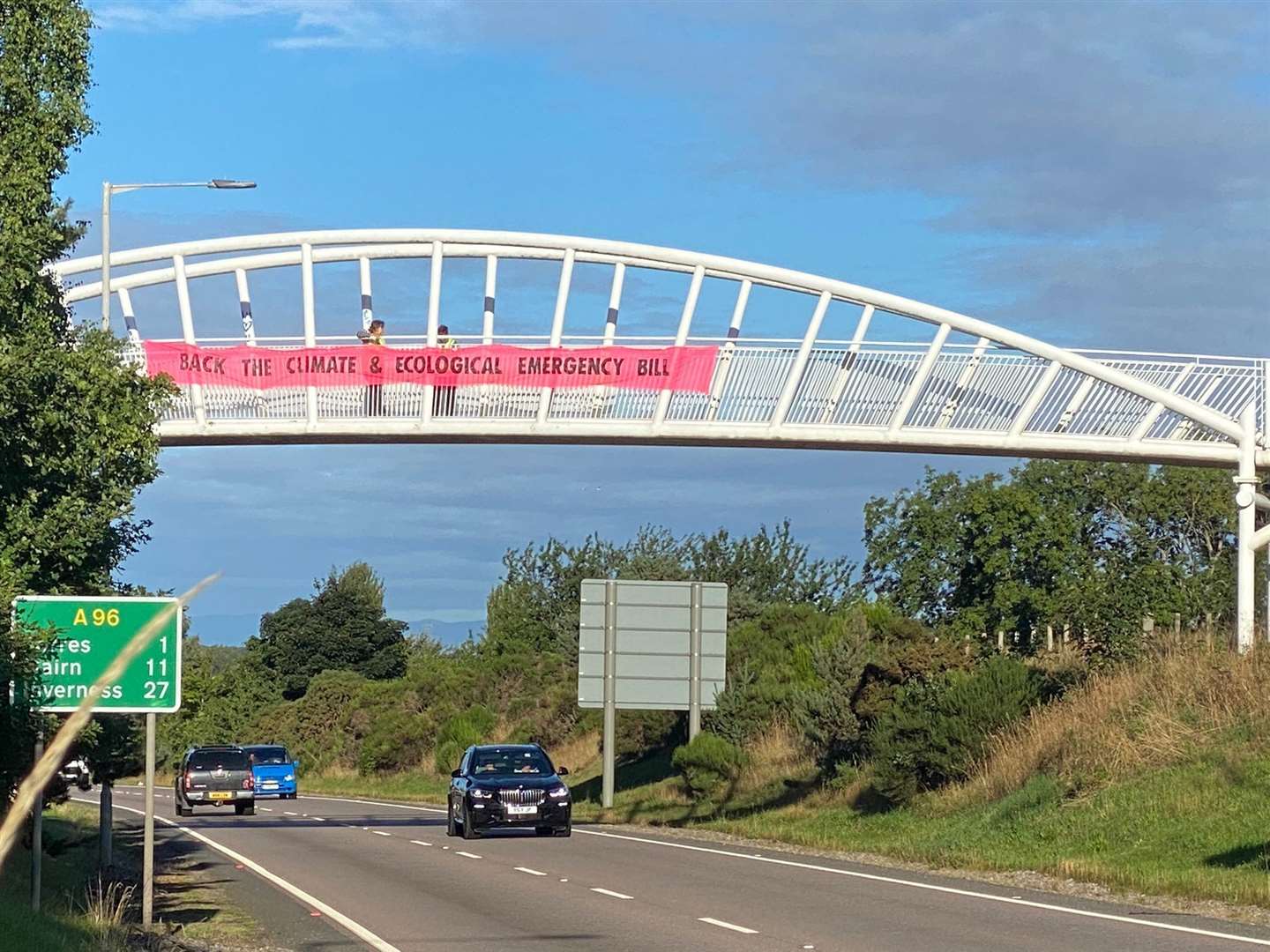 A banner draped across the bridge over the A96 is calling on Douglas Ross, Moray's Conservative MP, to back the Climate and Ecology Bill.