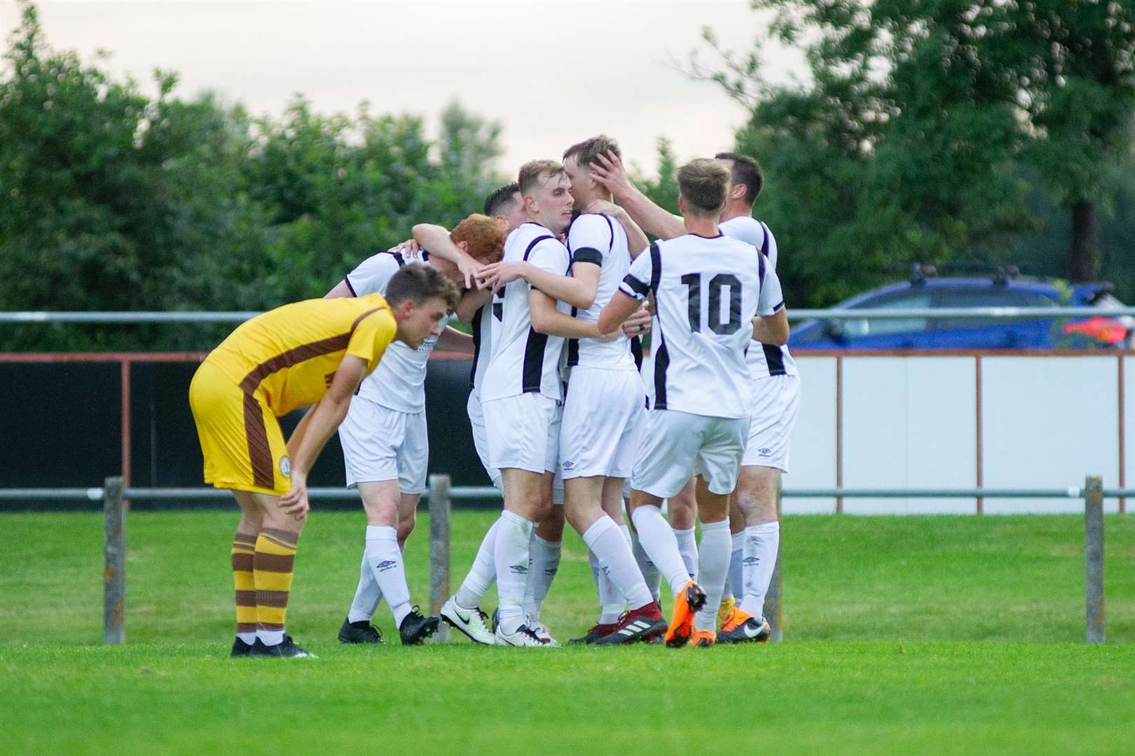 The Rothes team celebrate Alan Pollock's opener...Forres Mechanics (0) vs Rothes FC (3) - North of Scotland Cup - Mosset Park, Forres 04/08/2021...Picture: Daniel Forsyth..