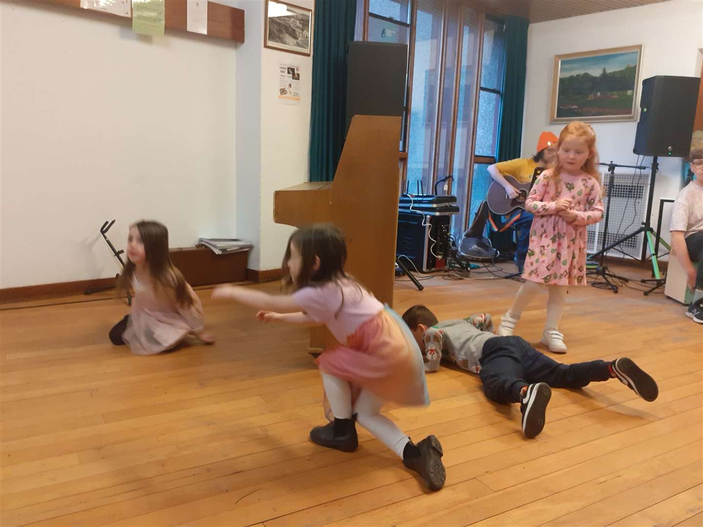 Children dancing in The Coffee House during the open mic session.