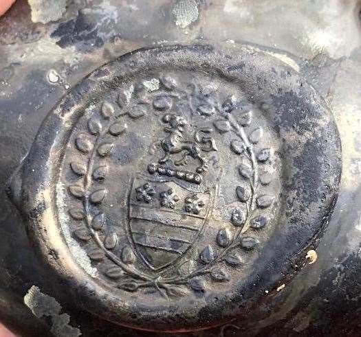 The crest of the Legge family – ancestors of George Washington, the first US President – was found on a bottle with the wreck (Norfolk Historic Shipwrecks/ PA)