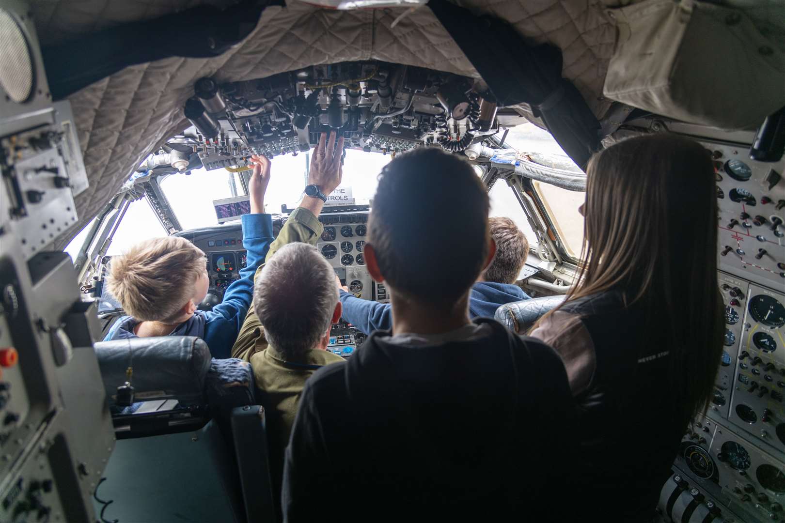 Attendees inside the cockpit of a Hawker Siddeley Nimrod.
