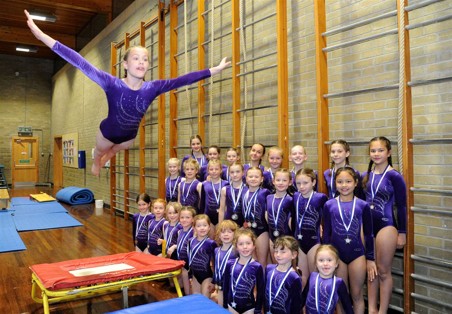High-flying Iris Whitton with her successful Forres Gymnastics Club pals. Picture: Eric Cormack. Image No. 044119.