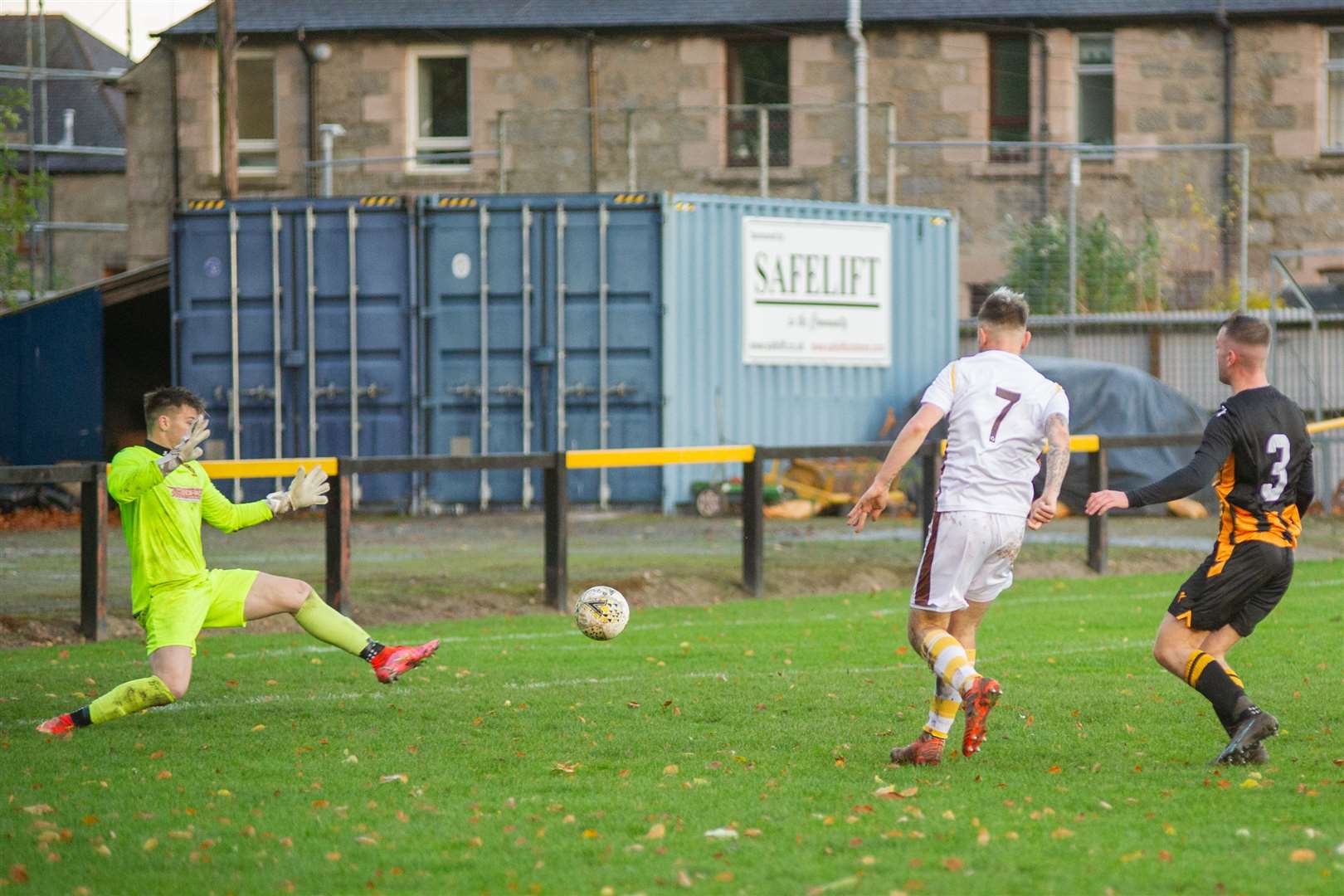 Paul Brindle slots home past Huntly keeper Tom Ritchie. Picture: Daniel Forsyth..