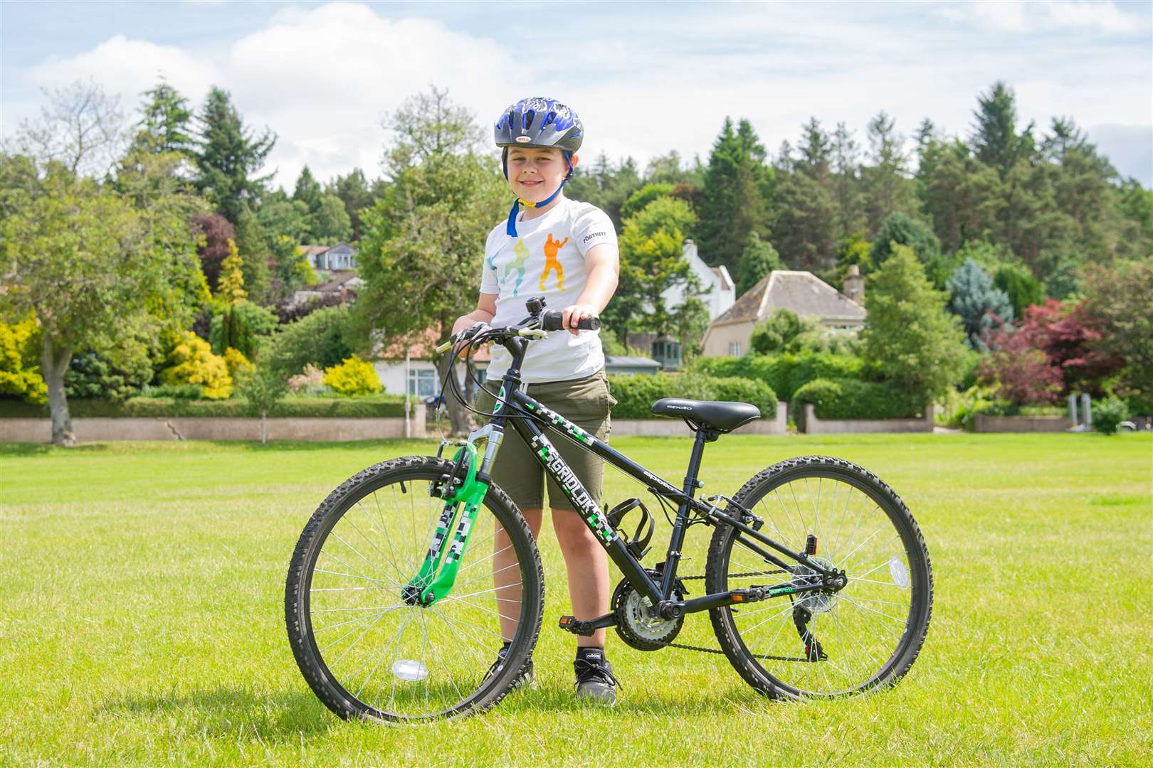 8-year-old Kristian Ross, from Forres, is cycling the distance from his home to Edinburgh Zoo as he raises money for the Highland Wildlife Park. Picture: Daniel Forsyth.