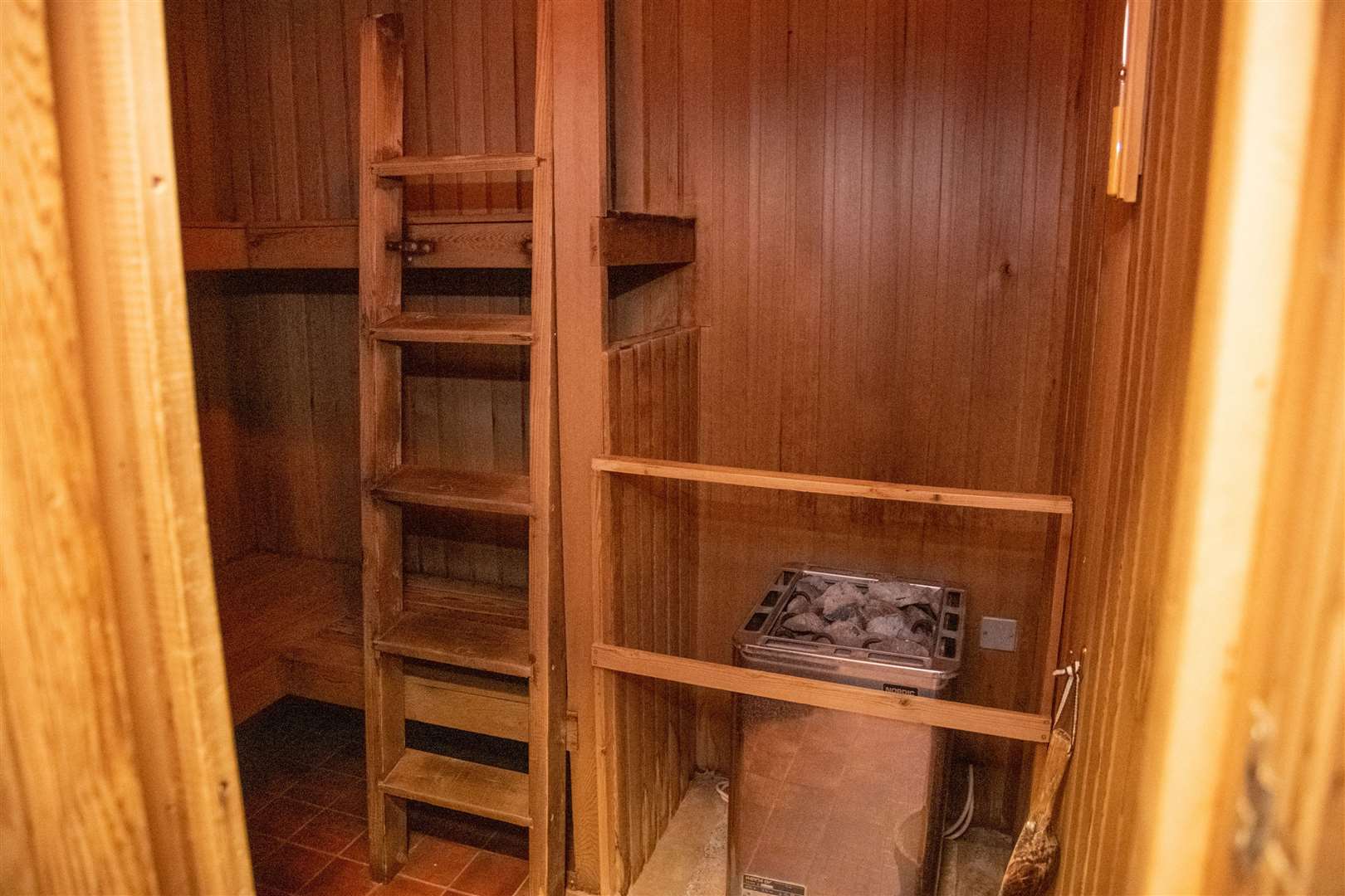 The pristine sauna leading up to a lounge area and plunge pool.