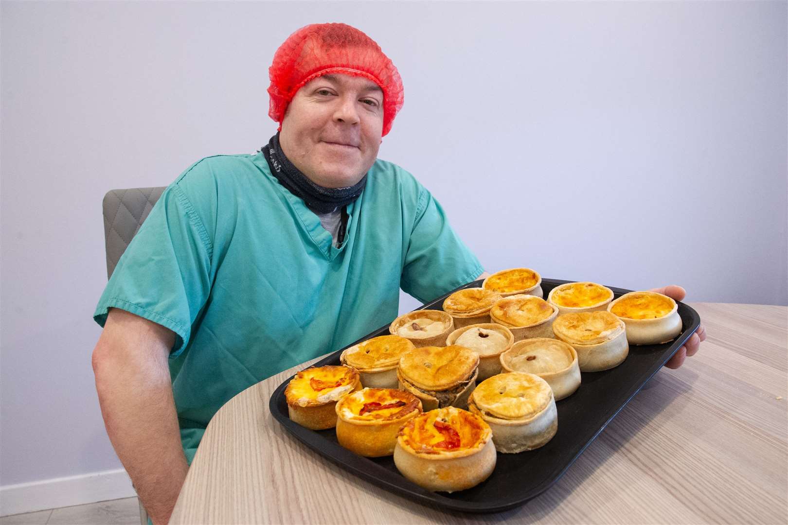 Michael Baranski with a tray of the pies that Maclean's Highland Bakery has entered into the championships. Picture: Daniel Forsyth