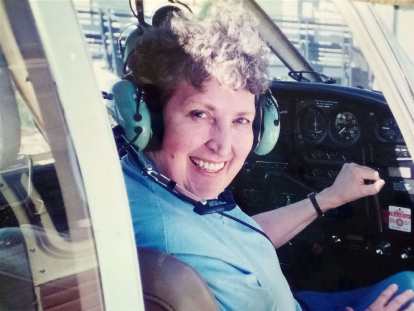 Ms Buckland in her younger days in her cousin’s Piper PA-28 Cherokee plane (Care UK/PA)