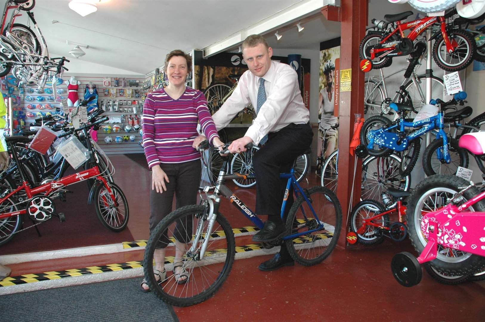 Heather Stuart (left) of Stuart's Cycles shows 'Gazette ' reporter Duncan Bick how to get his bike in gear.
