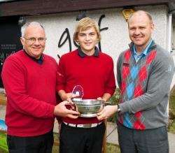 Forres Academy pupil, Marc Dingwalll picks up the Duncan Allen trophy for the best scratch score