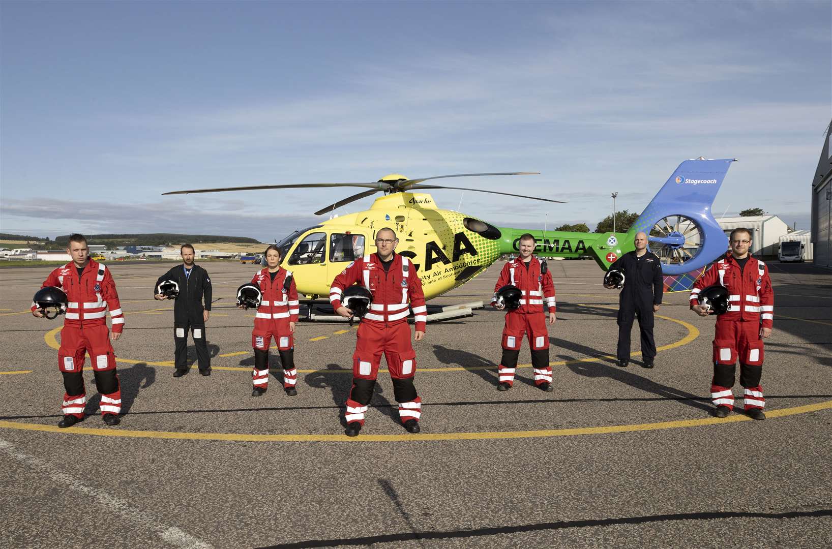 Scotland’s Charity Air Ambulance Base, Aberdeen (SCAA) home to Helimed 79.Pictured from left, Chriss Doyle (paramedic), Captain Jon Stupart (pilot), Laura McAllister (paramedic), Ewan Littlejohn (lead paramedic), Rich Forte (paramedic), Captain Pete Winn (pilot) and Owen McLauchlan (paramedic)..Picture by Graeme Hart..Copyright Perthshire Picture Agency