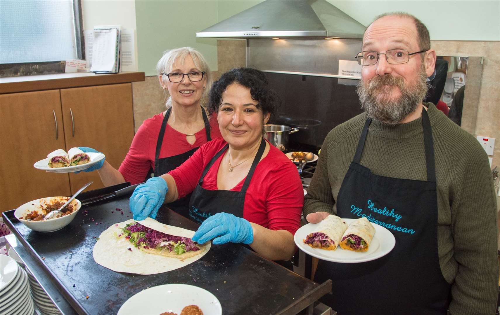 Wendy Robertson, Medine Duff and Eddie Duff serve and prepare food for the Mediterranean pop-up cafe...Picture: Becky Saunderson..