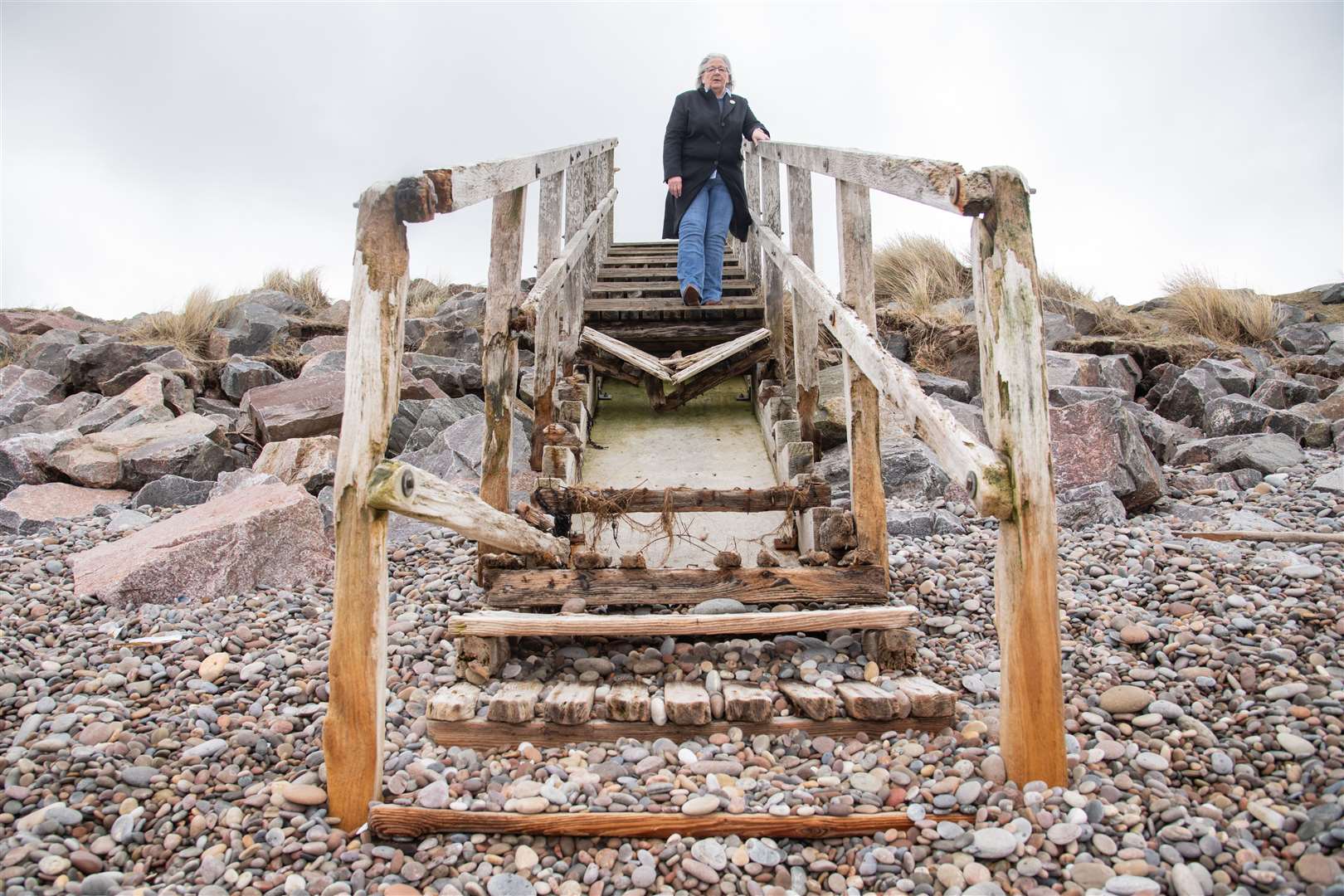 The Findhorn Village Conservation Company secretary Cathy Low on a badly damaged set of steps.