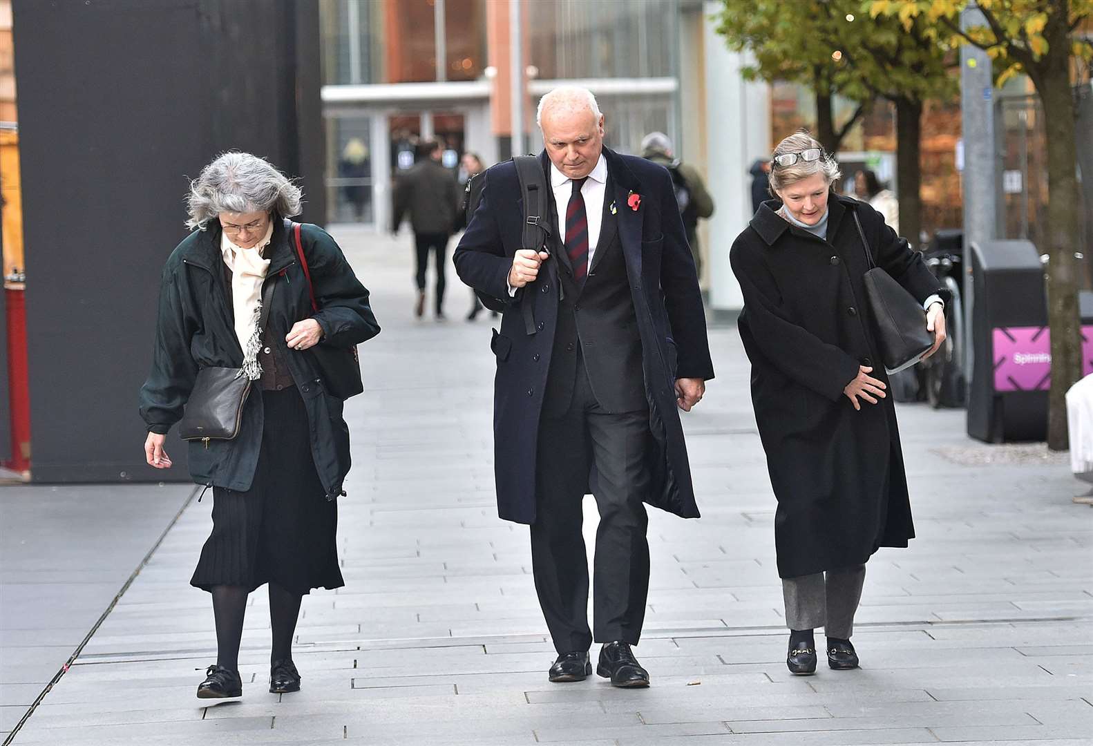 Sir Iain Duncan Smith leaving Manchester Magistrates’ Court with his wife Betsy and Primrose Yorke (left) (Steve Allen/PA)