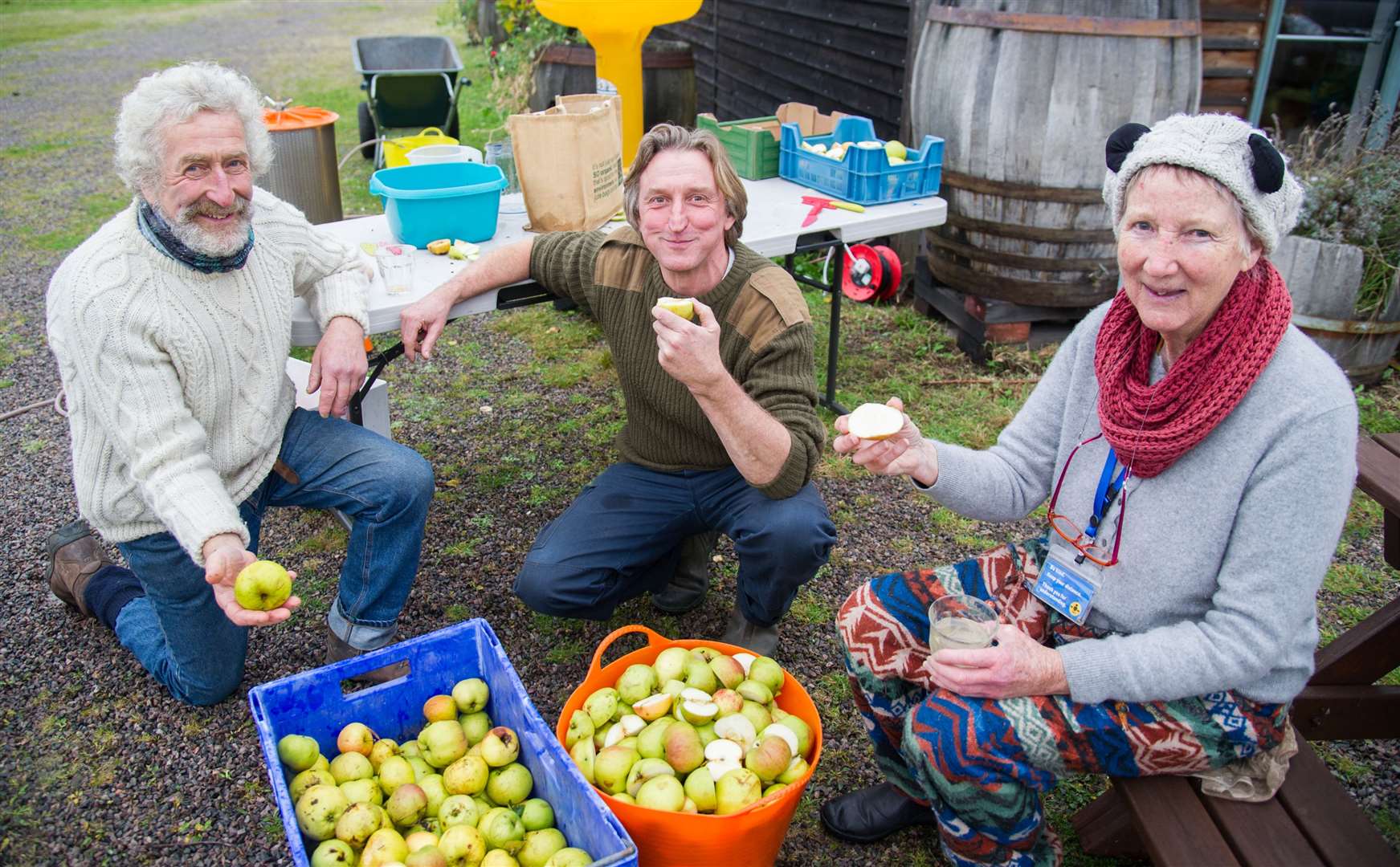 Transition Town Forres 'Apple Day' attendees enjoying fruit from local orchards.