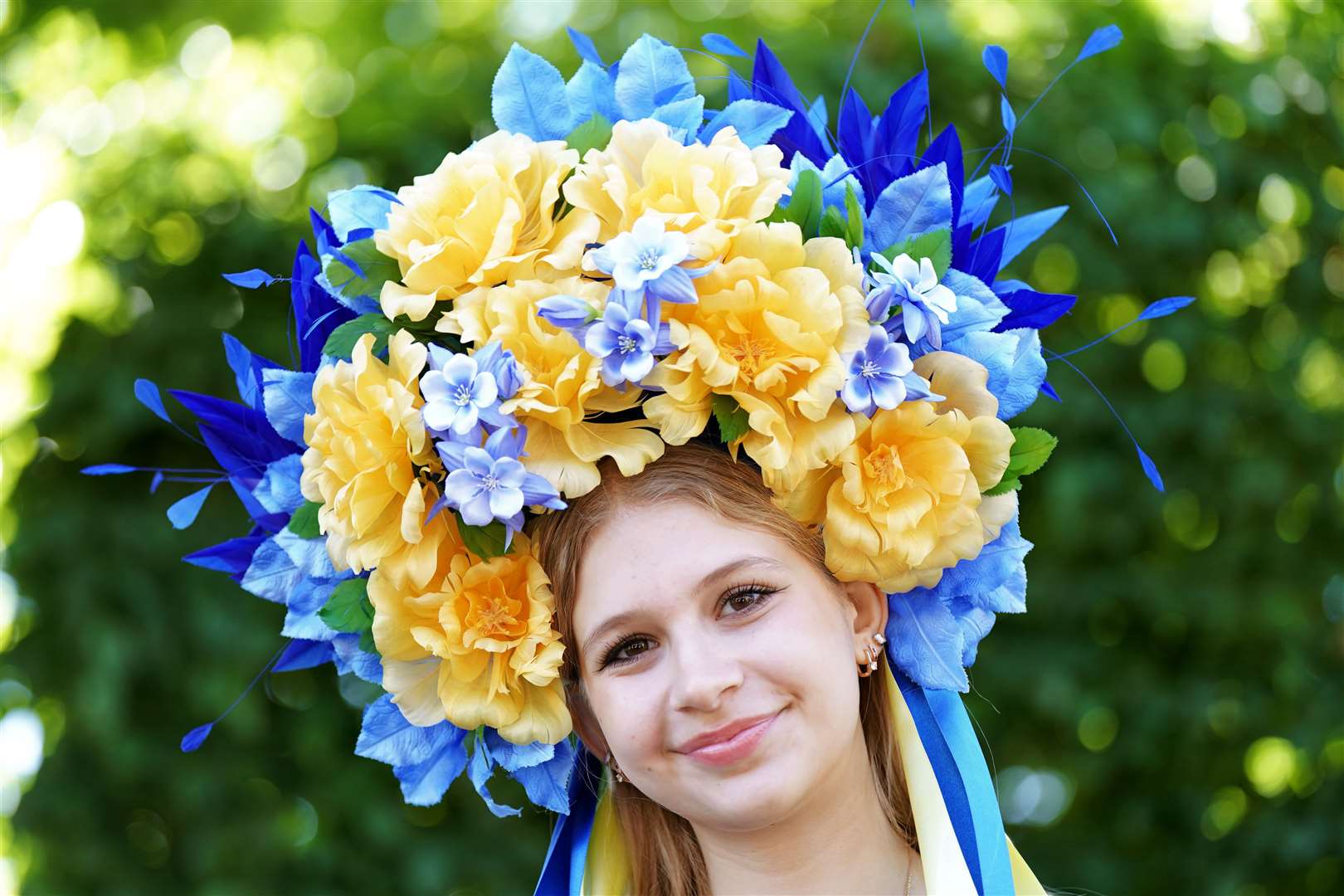 A racegoer from Ukraine, Maria Turtus, poses for a photograph (Aaron Chown/PA)