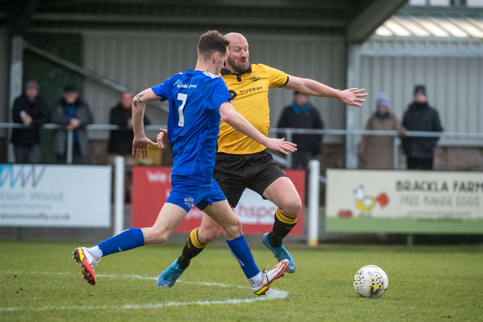 Nairn's Ross Tokley makes a challenge on Lossie's Ryan Farquhar in Saturday's match at Station Park..Picture: Callum Mackay..