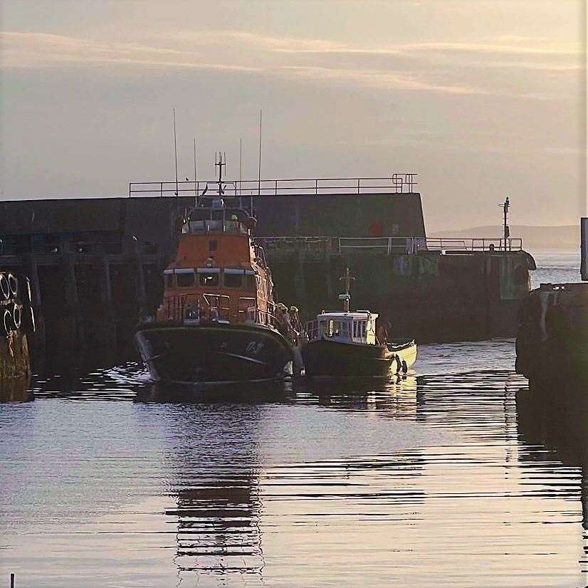 Help is at hand – the William Blannin tows a pleasure craft to the safety of Buckie Harbour after engine failure set it adrift off the coast of Cullen in May.
