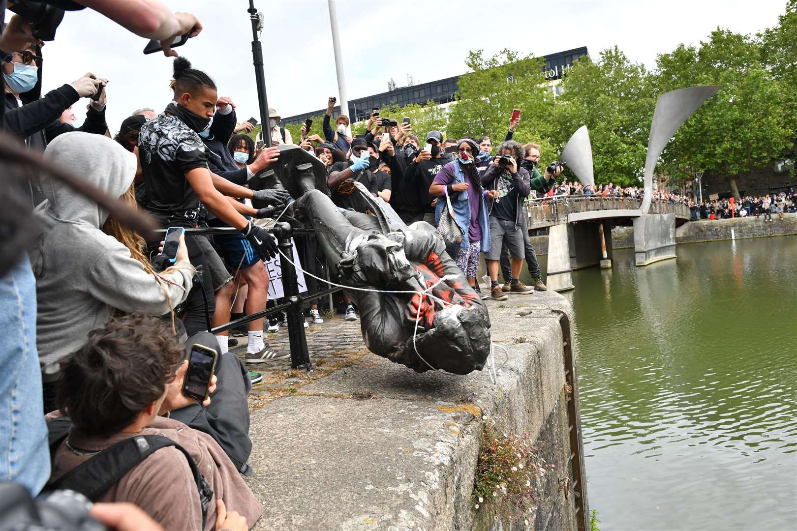 Protesters throw a statue of Edward Colston into Bristol harbour (Ben Birchall/PA)