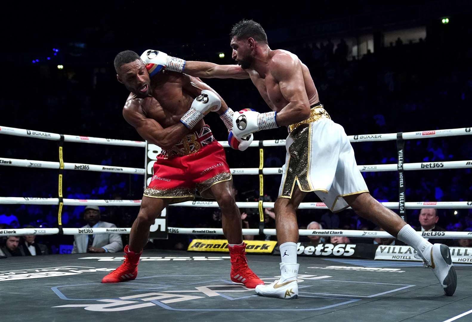 Amir Khan, right, in action against Kell Brook at the AO Arena in Manchester (Nick Potts/PA)