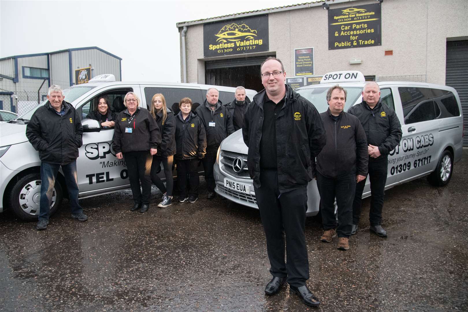 Stephen Duncan (front) and his employees at Spot On Cabs at their Greshop headquarters. Picture: Daniel Forsyth