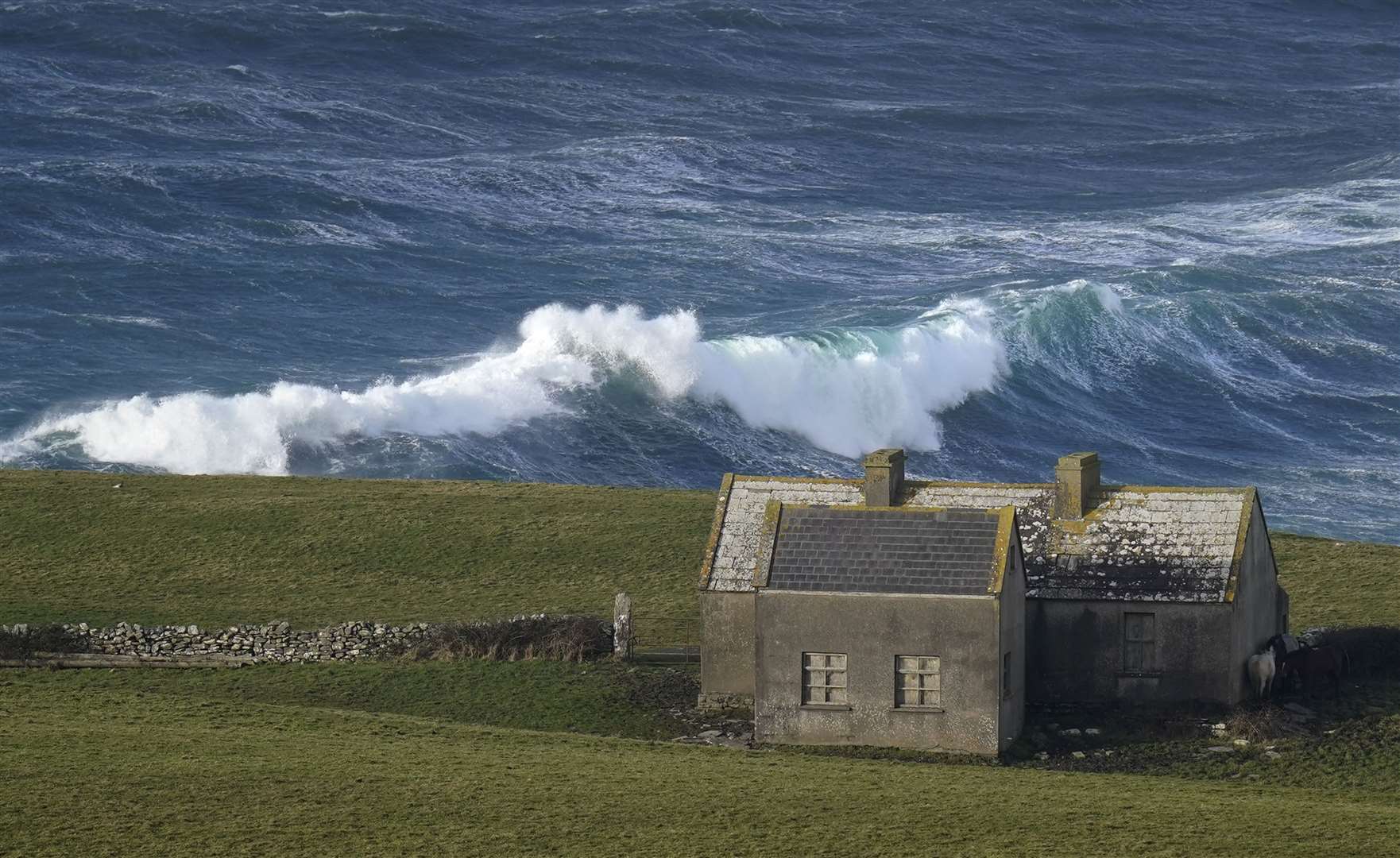 Waves crashing against the shore at Doolin in County Clare (Niall Carson/PA)