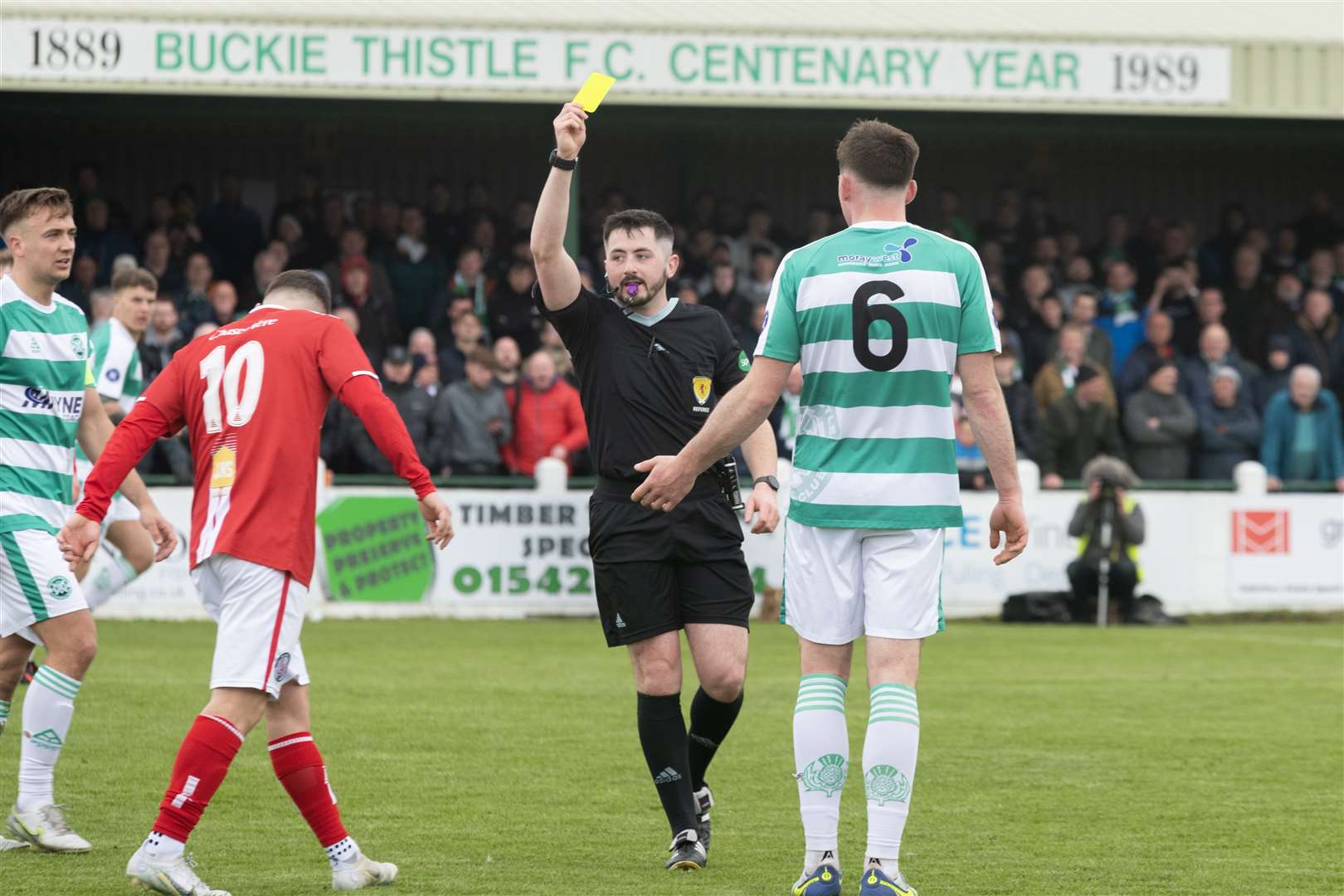Referee Harry Bruce giving Buckie's Jack Murray a yellow card...Buckie Thistle F.C. v Brechin City F.C. Highland League Final at Victoria Park. ..Picture: Beth Taylor.