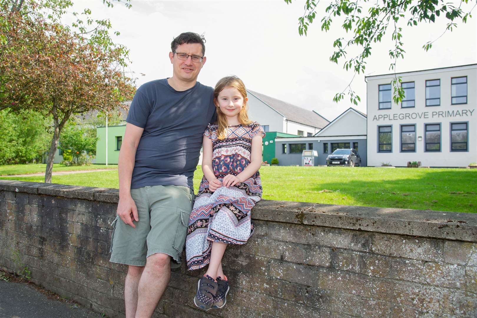 Forres Councillor Aaron Mclean with his daughter at her school - Applegrove Primary. Picture: Daniel Forsyth..