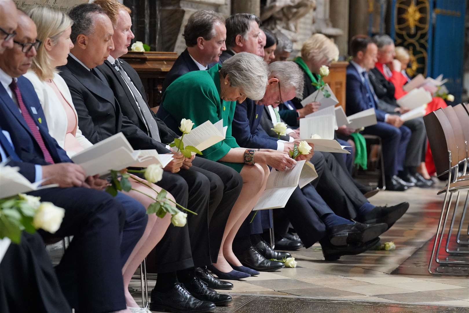 Theresa May and Michael Gove in prayer during the Grenfell fire memorial service at Westminster Abbey (Jonathan Brady/PA)