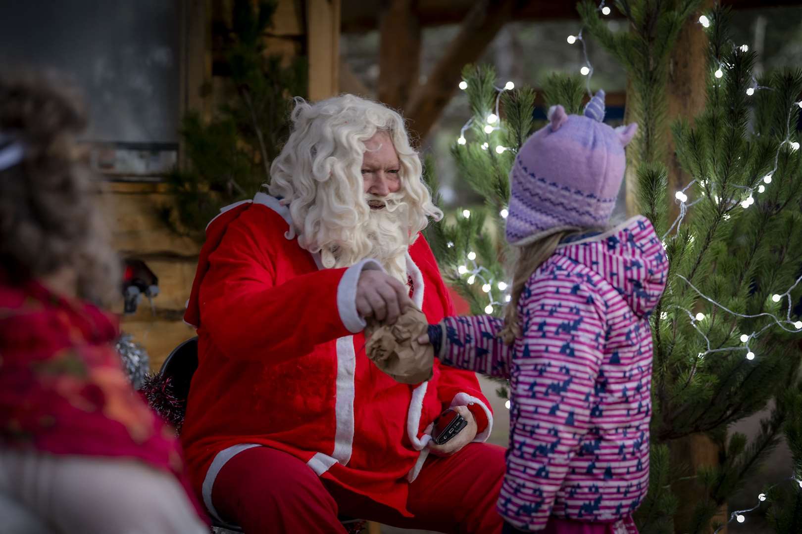 Santa sharing one of his small gifts. Pictures by Mark Richards