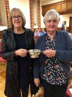 Marjory Wallace receiving the Flower Show Quaich from Institute secretary, Dorothy Gough.