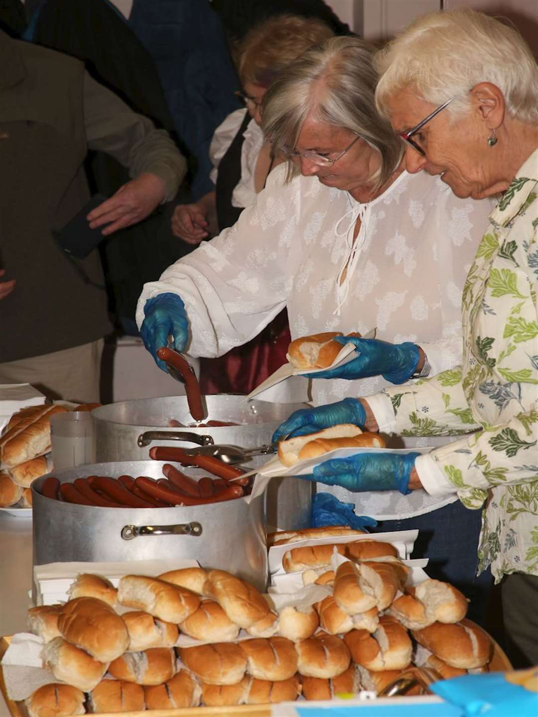 The twinning association's sausage team of Eileen, Lynne and Jean in action.
