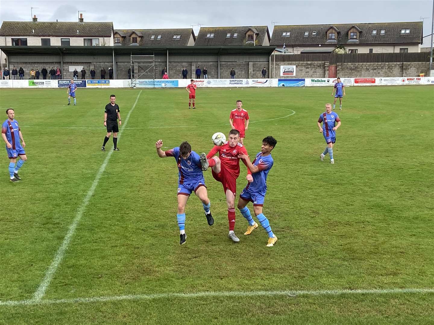Lossiemouth's James Leslie (centre) keeps possession against Keith pair Tom Andrews (left) and Rhys Thomas in last season's meeting between the sides.