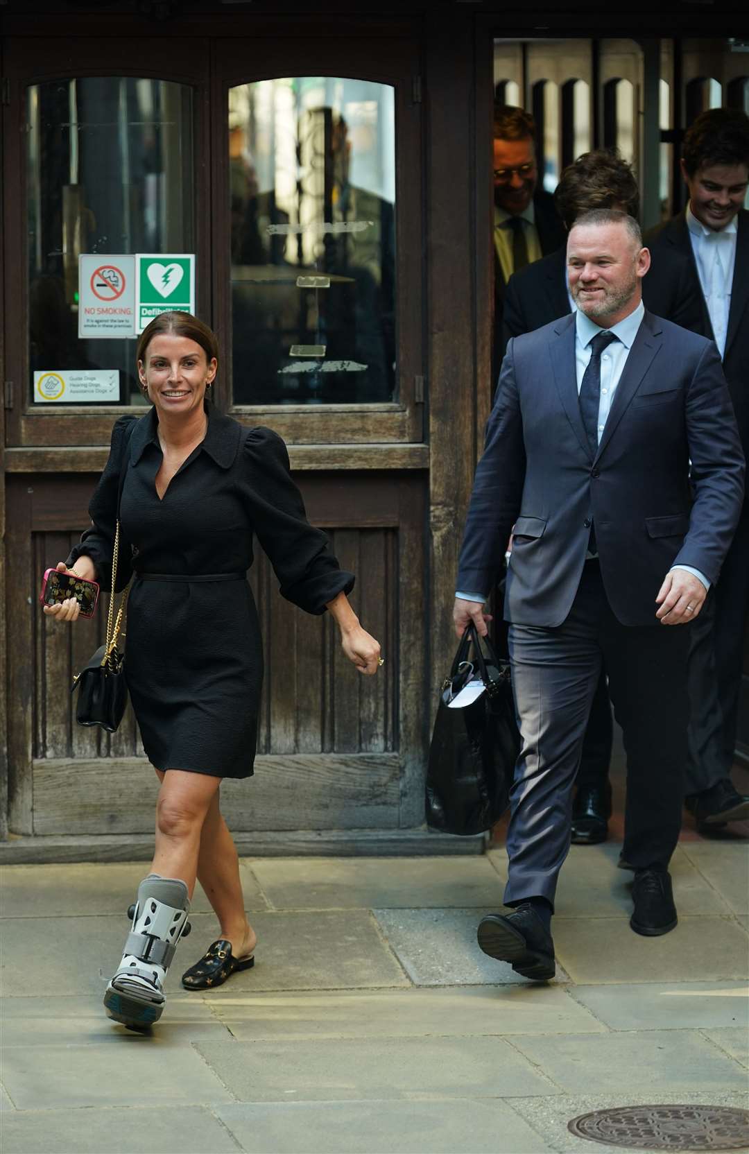 Coleen and Wayne Rooney leave the Royal Courts of Justice (Yui Mok/PA)