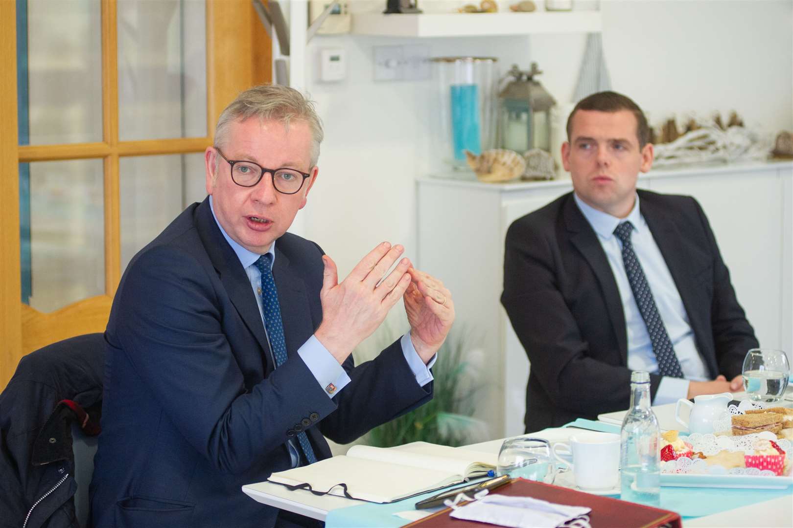 Michael Gove (left) and Moray MP Douglas Ross (right). Picture: Daniel Forsyth