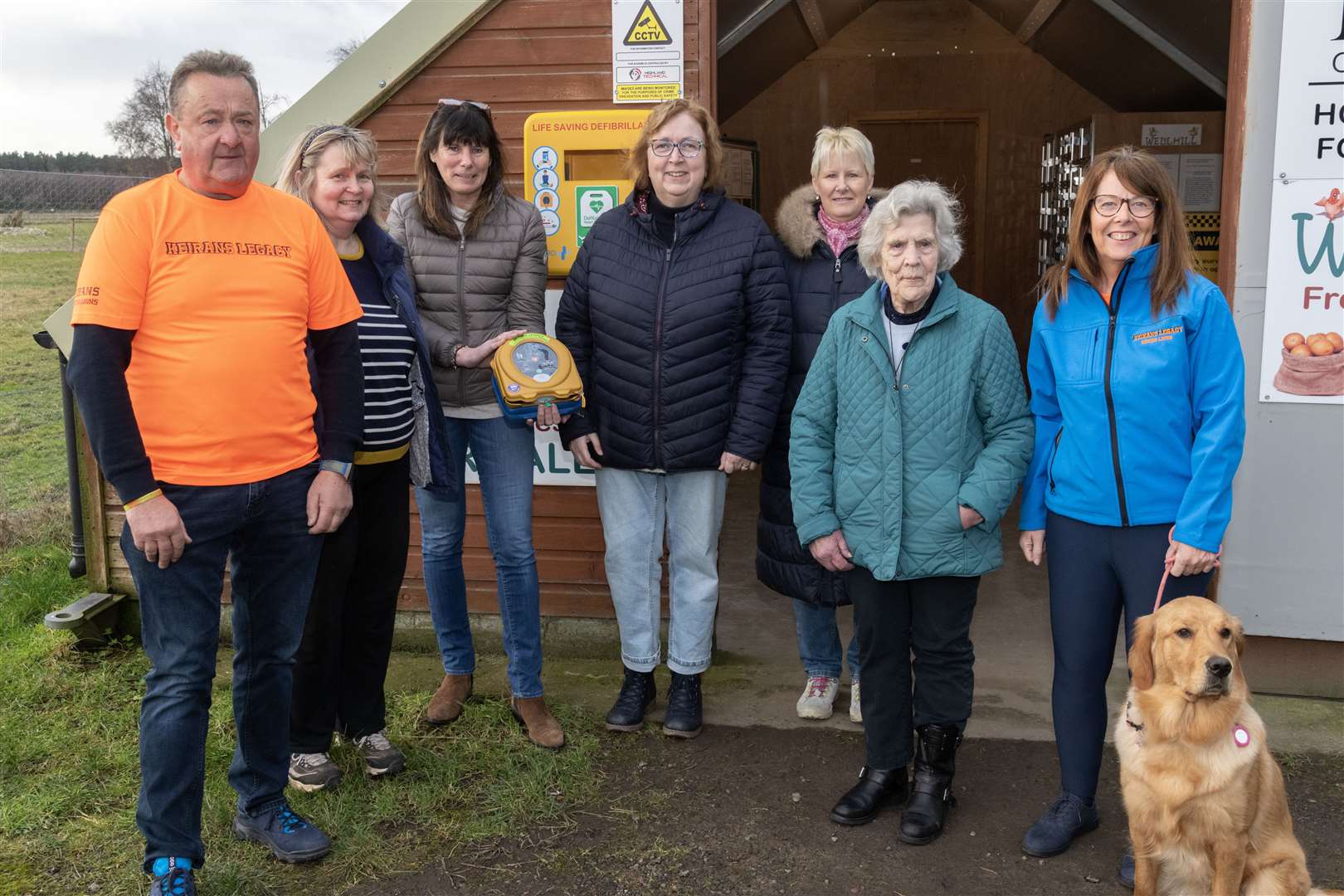 Gordon McKandie of Keiran's Legacy, Wellhill Farm owner Ilene Taylor and Dyke Landward Comunity Council members Jackie Davidson, Caroline Macleod, Sheena Tulloch and Wendy McLaren, and Sandra McKandie of Keiran's Legacy outside the Wellhill Farm Shop where they have installed a defibrillator. Picture: Beth Taylor