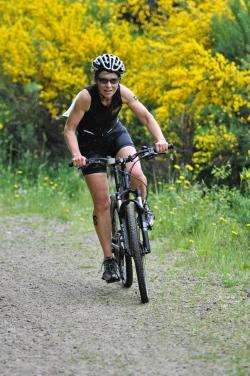 Nadine Williams of Forres Harriers takes a sharp bend in Sanquhar Woods during the Forres Try Triathlon.
