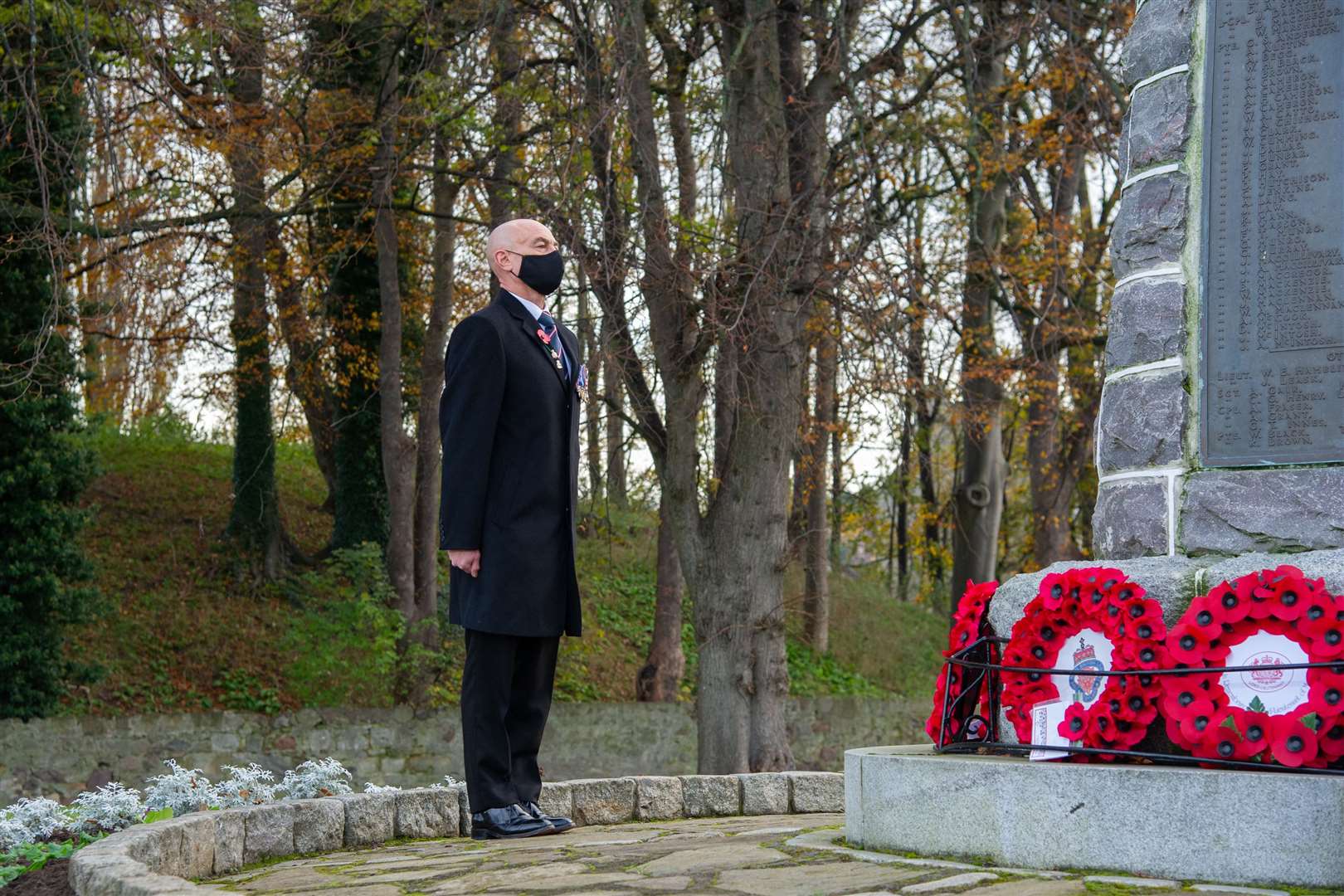 Tony Broadhurst, of the Moray Royal Air Forces Association, lays a wreath at the Forres war memorial on Remembrance Sunday 2020. Picture: Daniel Forsyth.