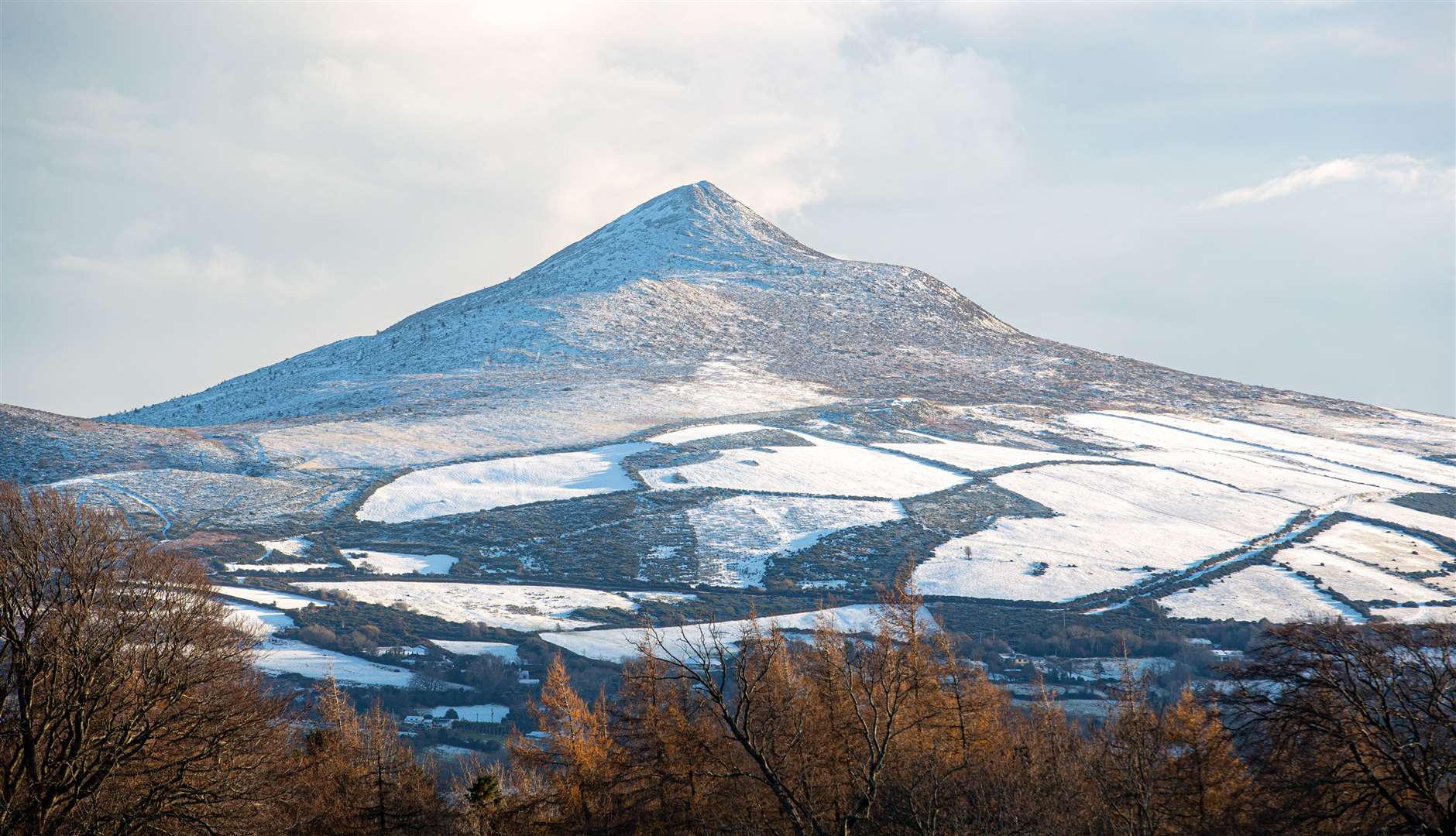 A view of Sugarloaf mountain in Wicklow covered in snow as Ireland is hit by cold weather (Damien Storan/PA)