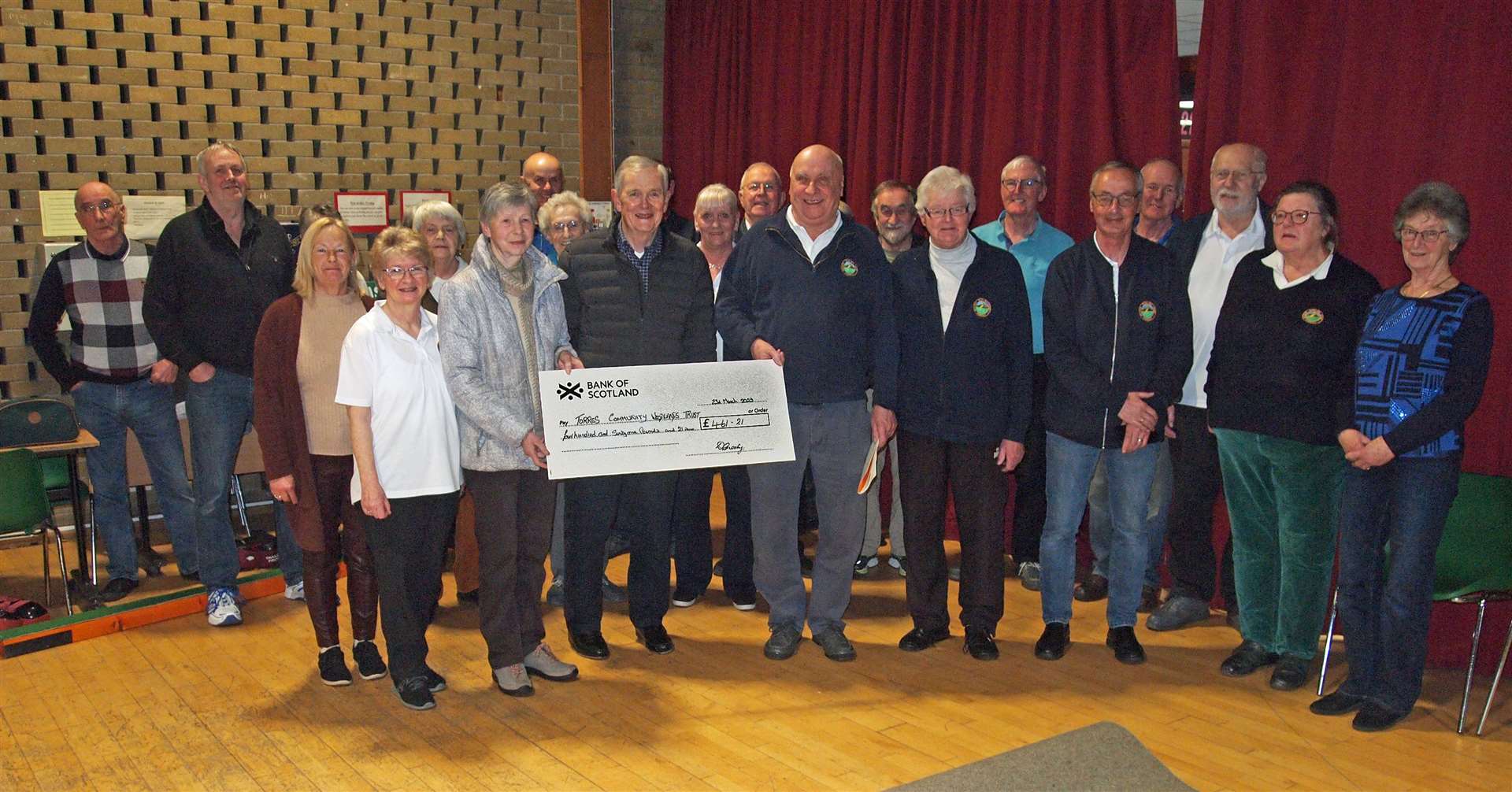 Forres Victoria Indoor Bowling Club members presenting a cheque to Gisela MacFarquhar and Donald Wright of Forres Community Woodlands Trust.