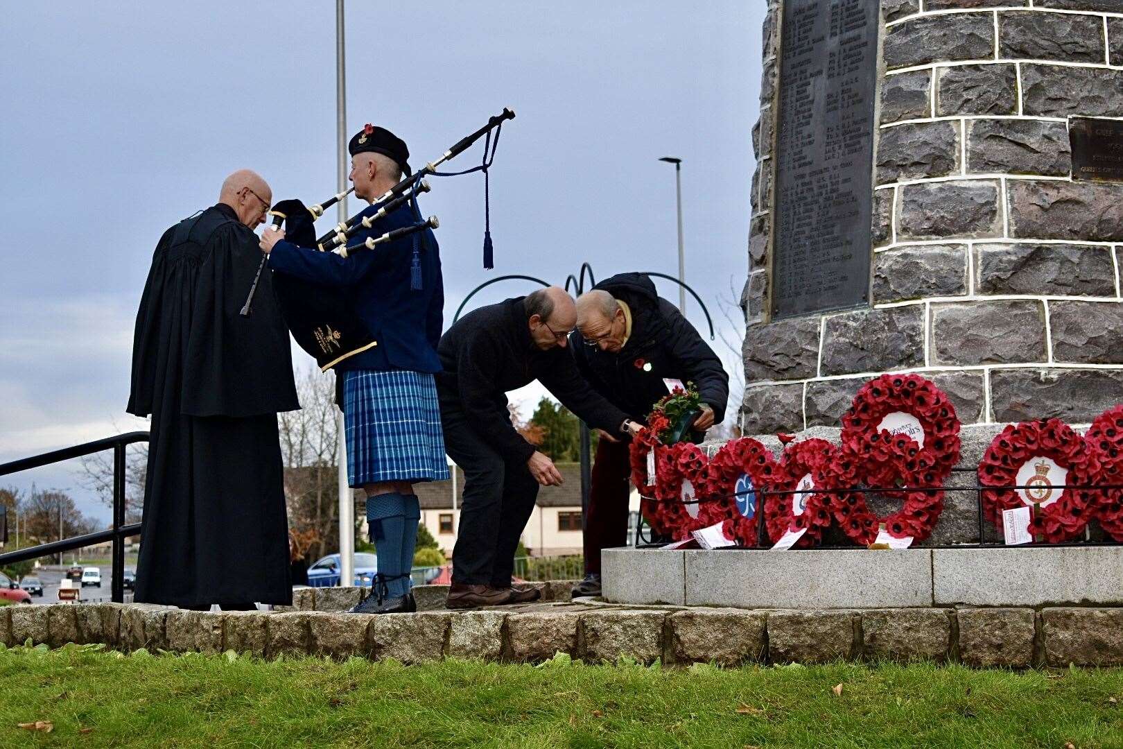 Mark Dammer, left, and Franz Rolinck, right, lay their wreaths at the War Memorial. Photo: Phil Coulby
