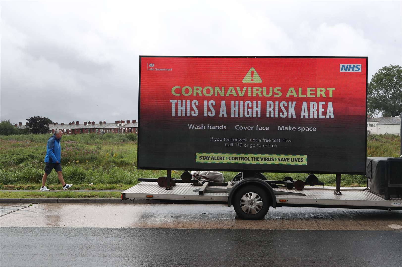 A mobile advertising vehicle displaying a coronavirus high risk area warning in Oldham (Peter Byrne/PA)